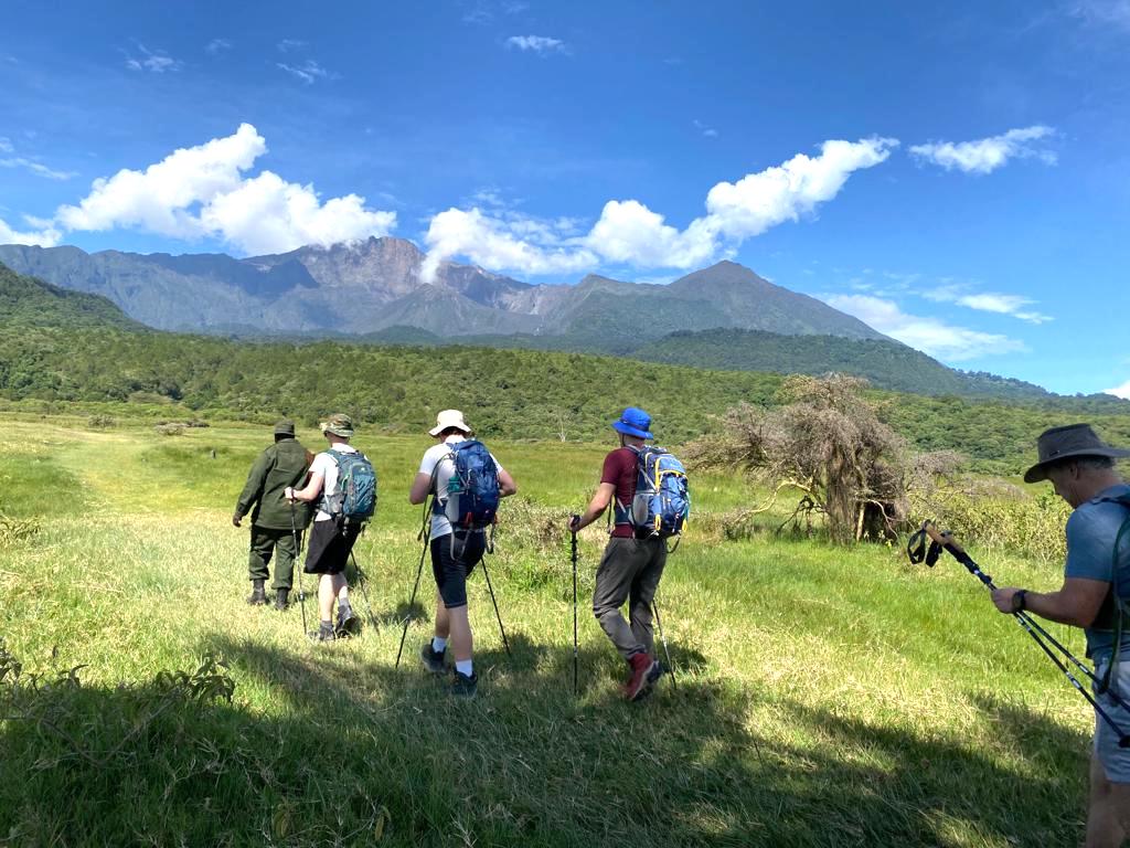 Walking safari in Arusha National Park with Mount Meru